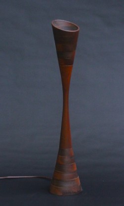 Early experiment in combining form with light, mahogany